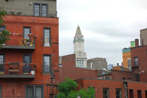 Red brick buildings with a clock tower in boston.