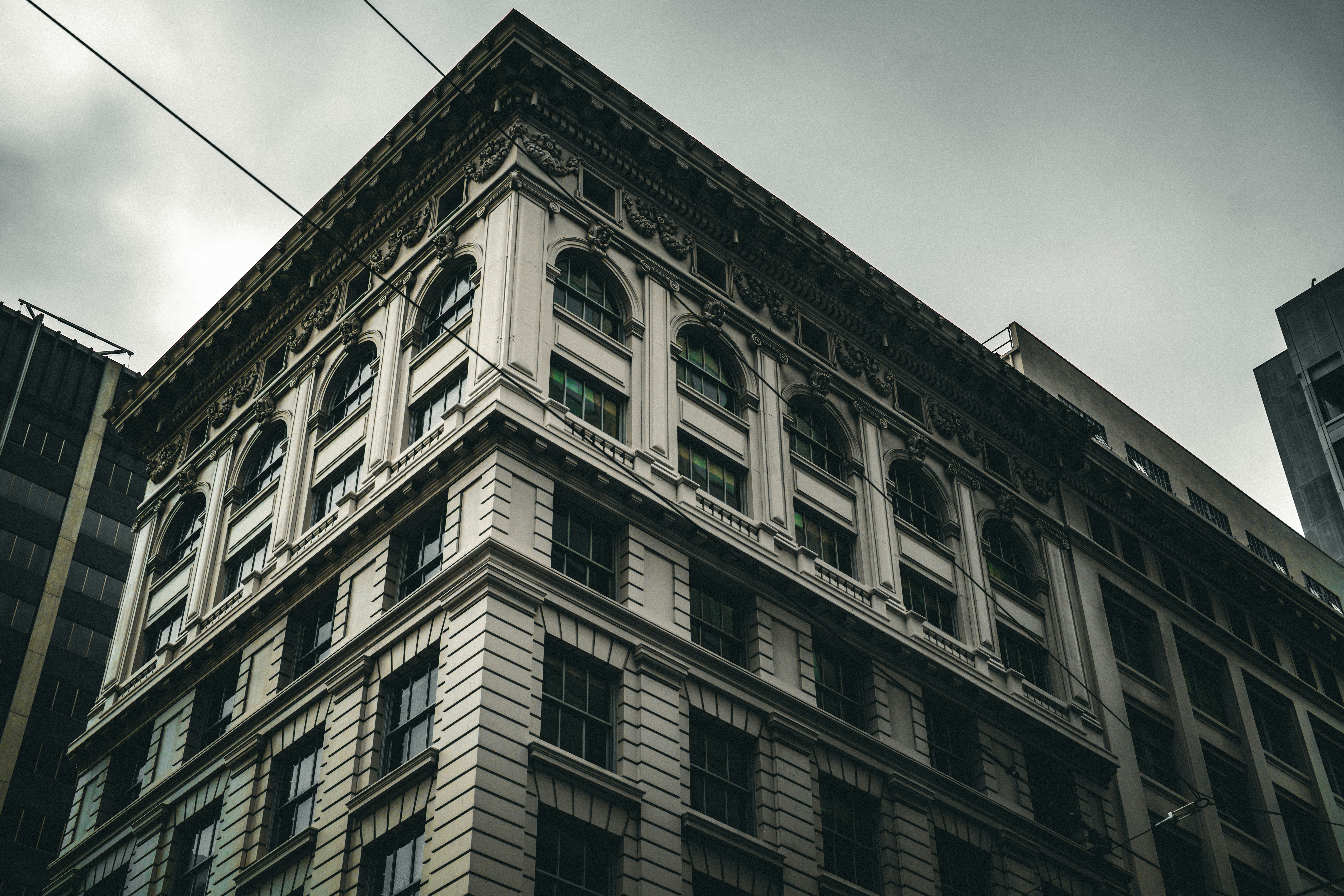 Ornate building facade against a cloudy sky.