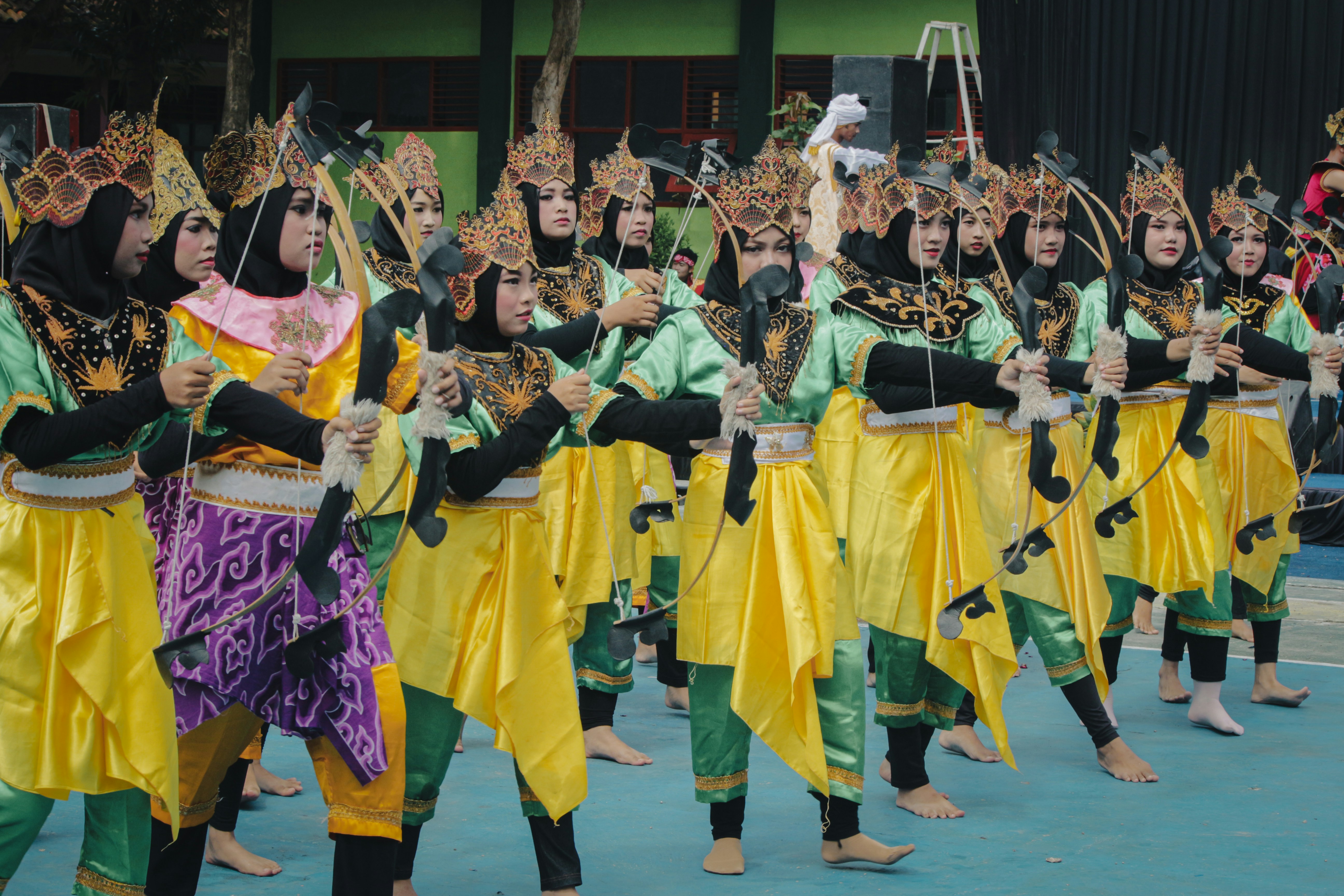 Group of performers in traditional colorful costumes
