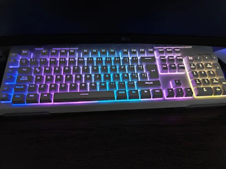 A white keyboard with colorful rgb lighting
