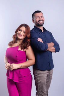 A smiling woman and man stand together.