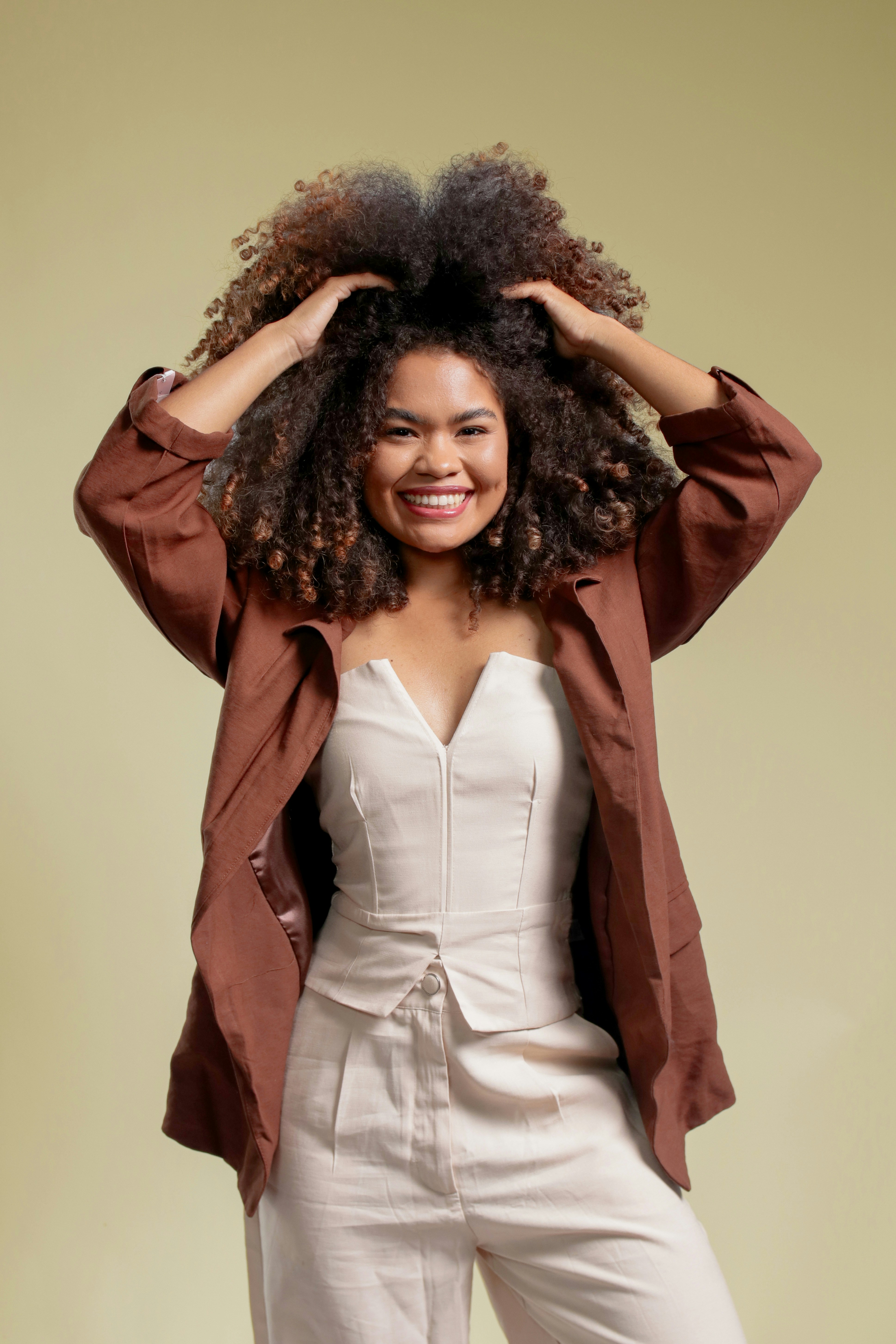 Smiling woman with voluminous curly hair