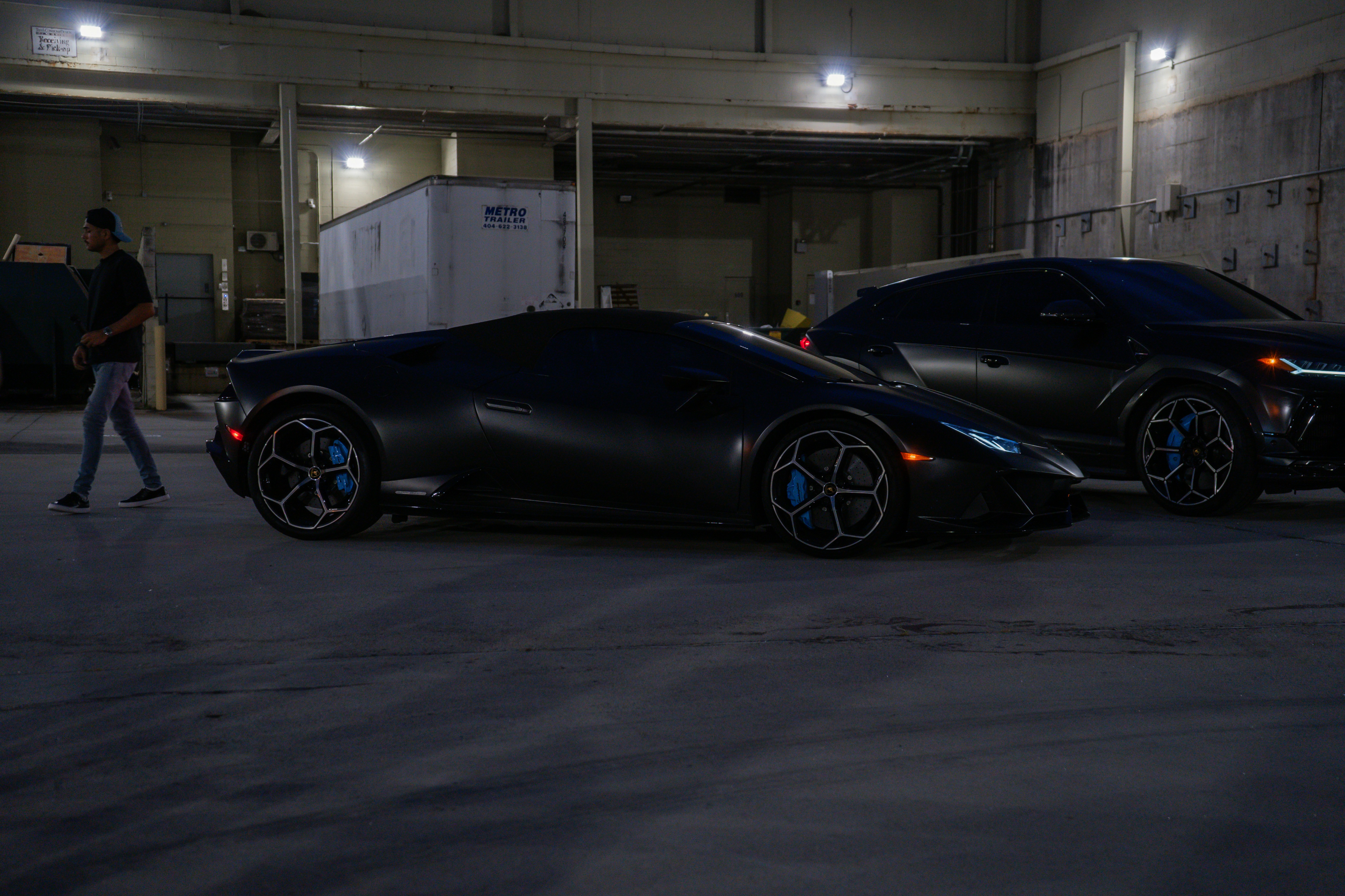 Tesla Model 3 and Model Y parked on a quiet suburban street