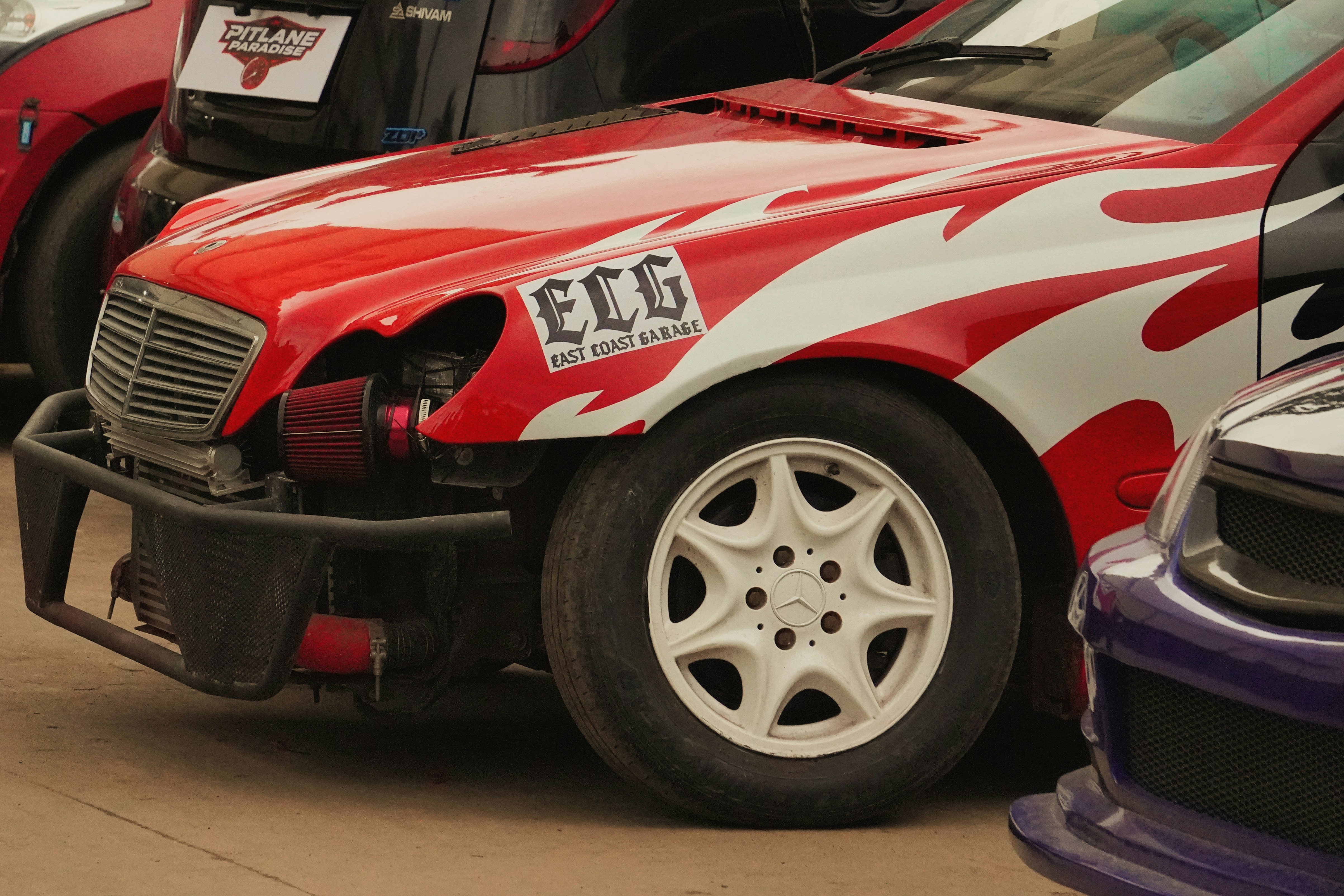 Red race car with white flames and ecg logo.