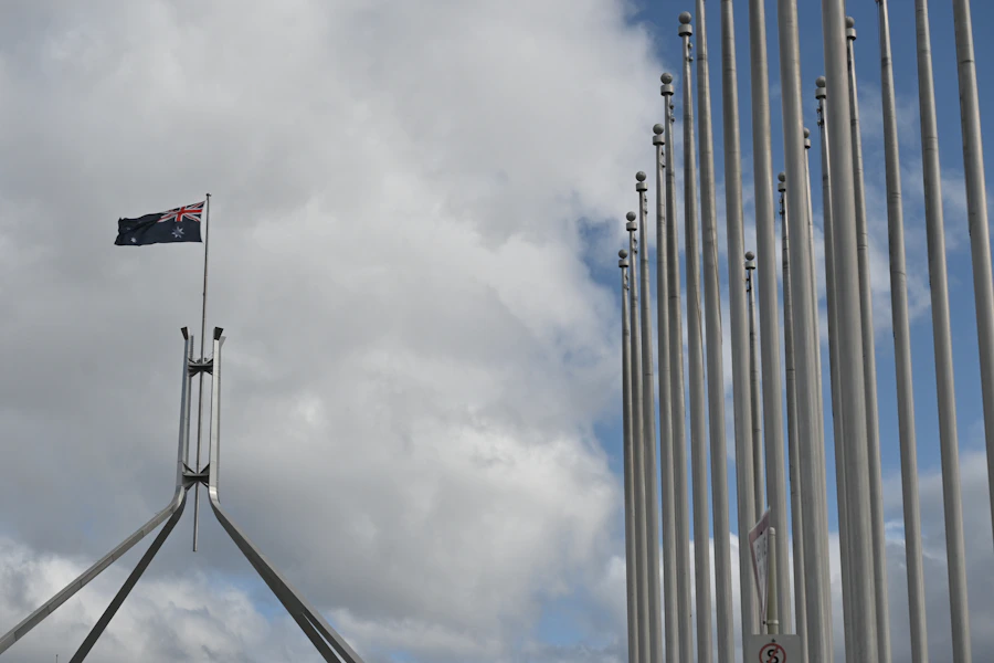 Australian flag and Parliament House in Canberra