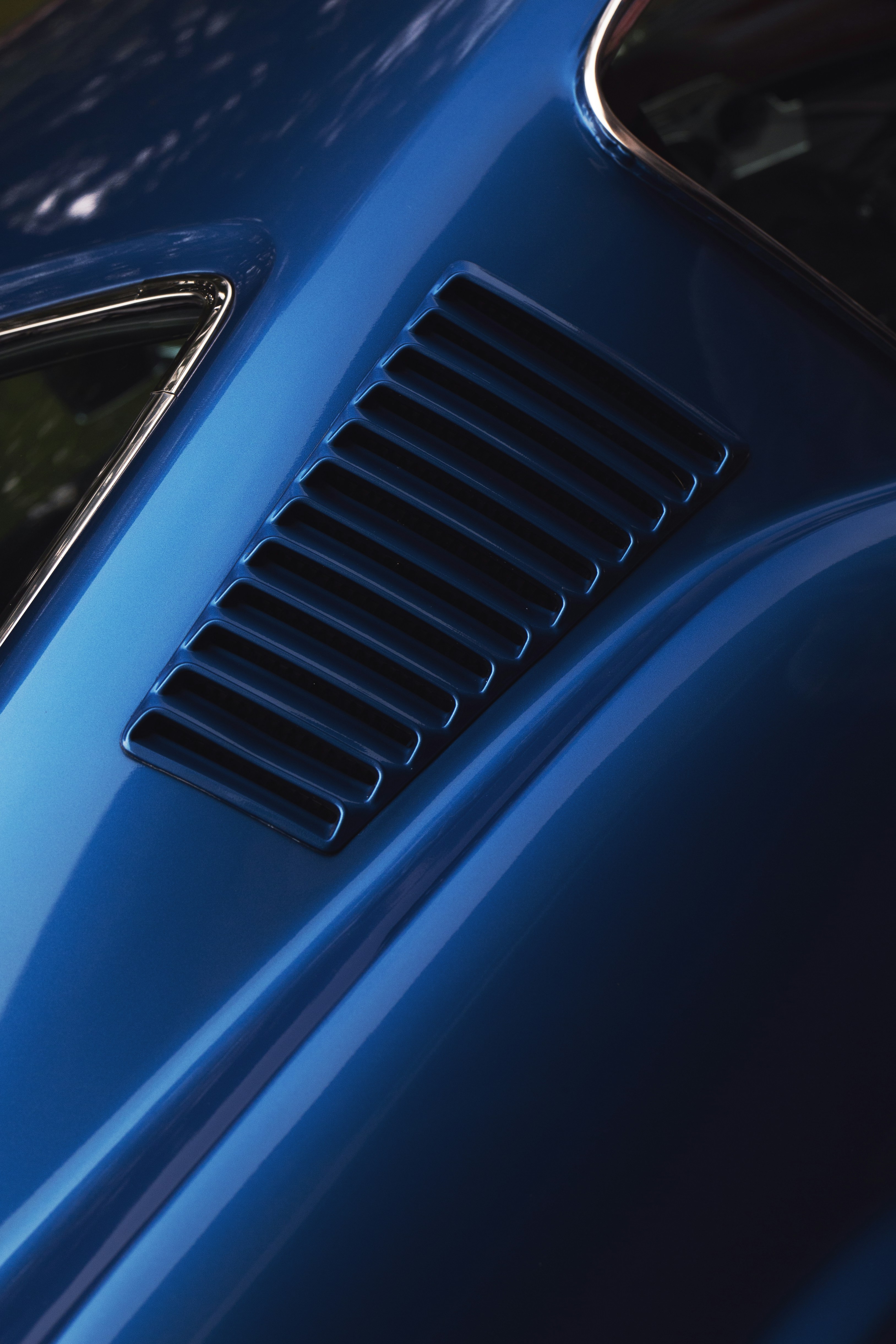 Close-up of a blue car's vent