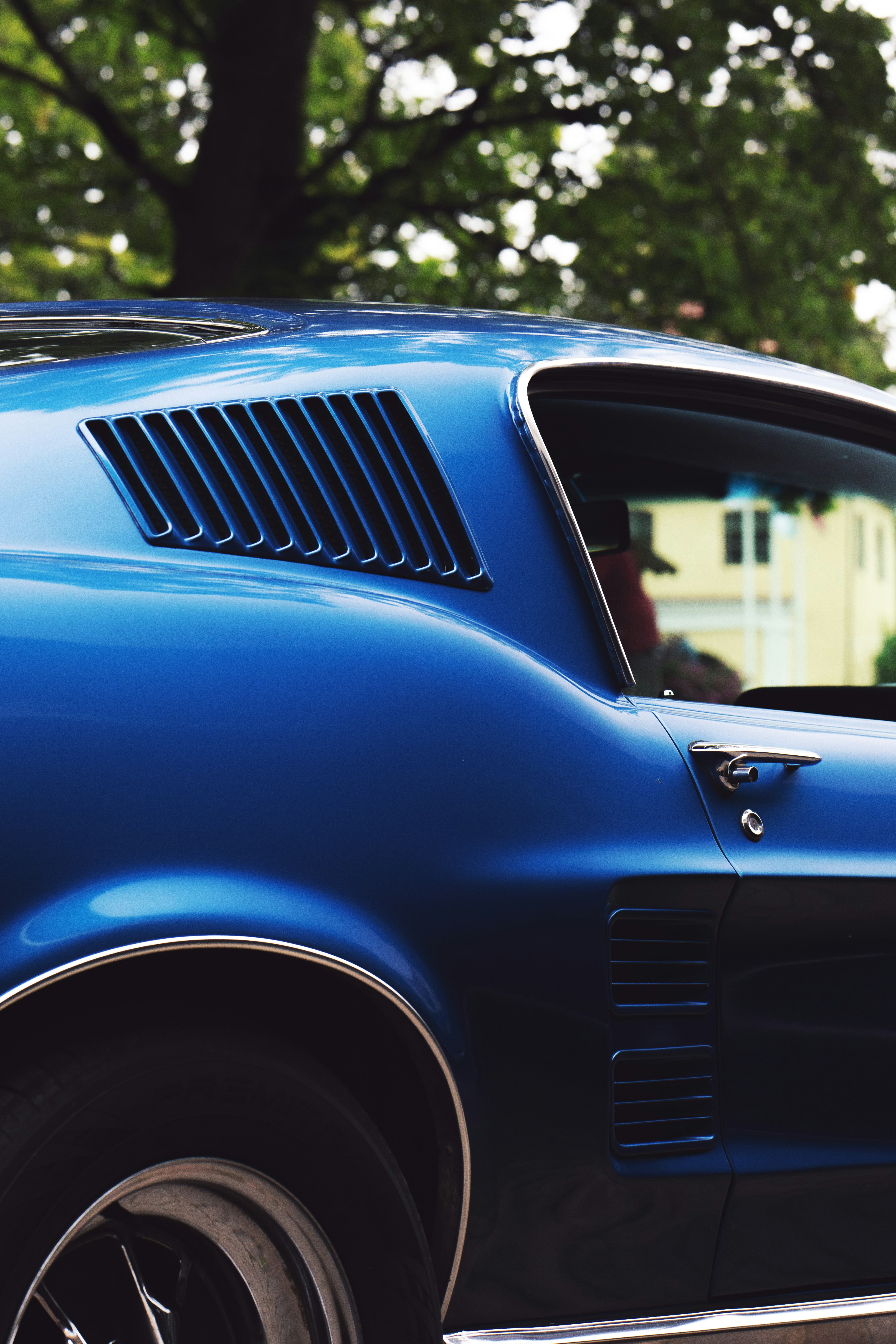 Close-up of a vintage blue car's side