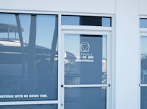 Modern building entrance with glass doors and windows
