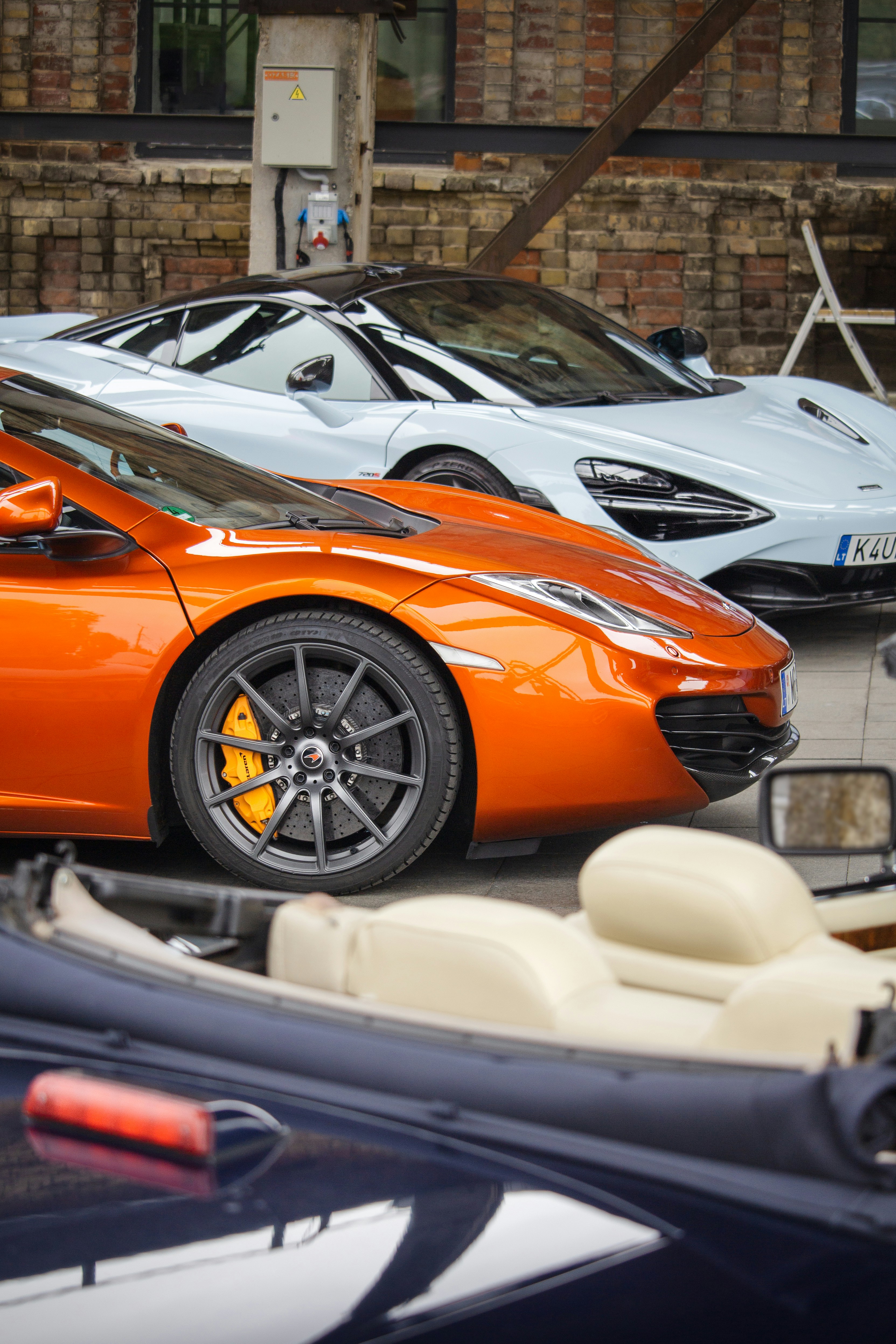 Two luxury sports cars parked side by side.