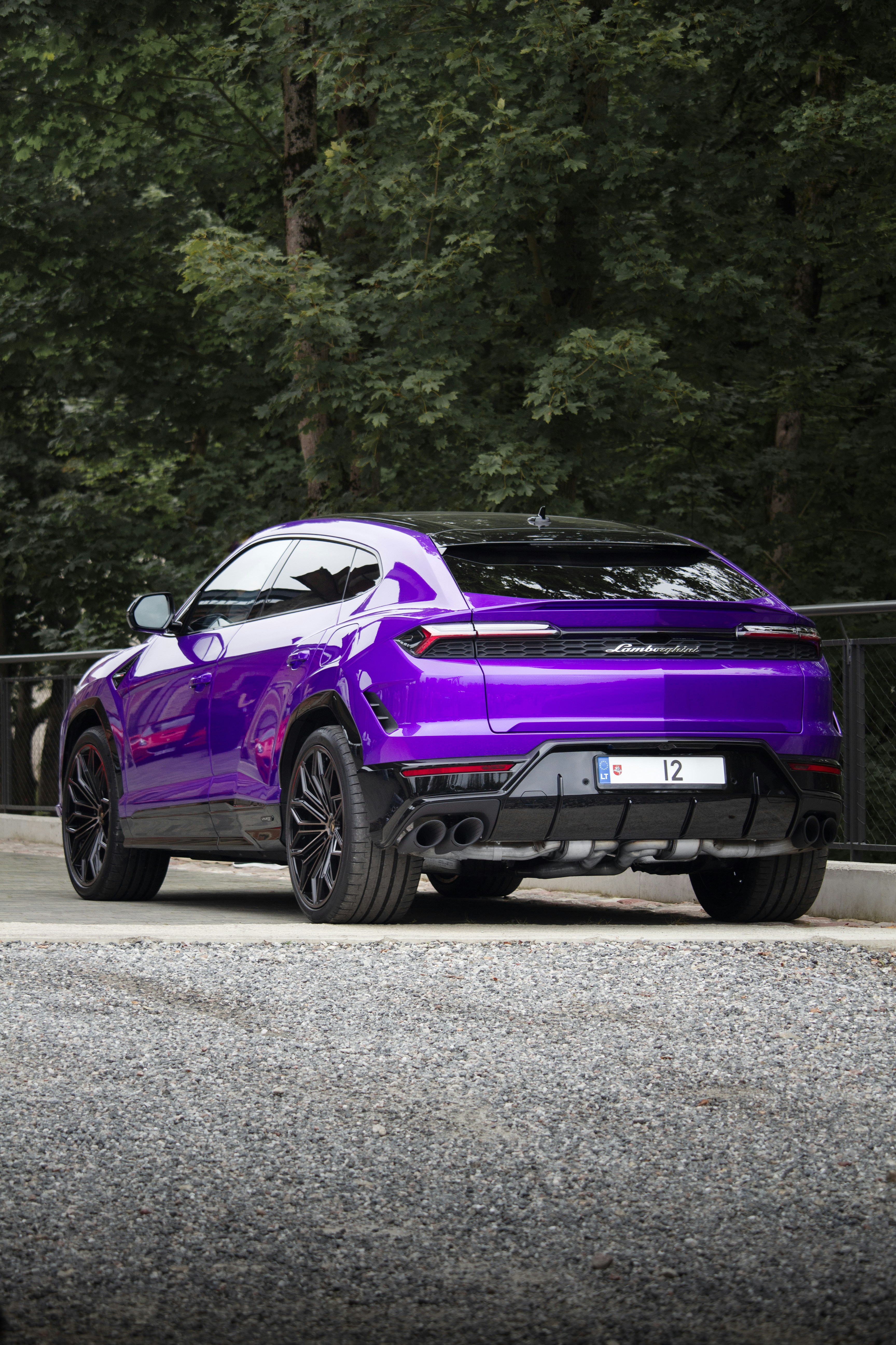 A vibrant purple sports car parked outdoors.