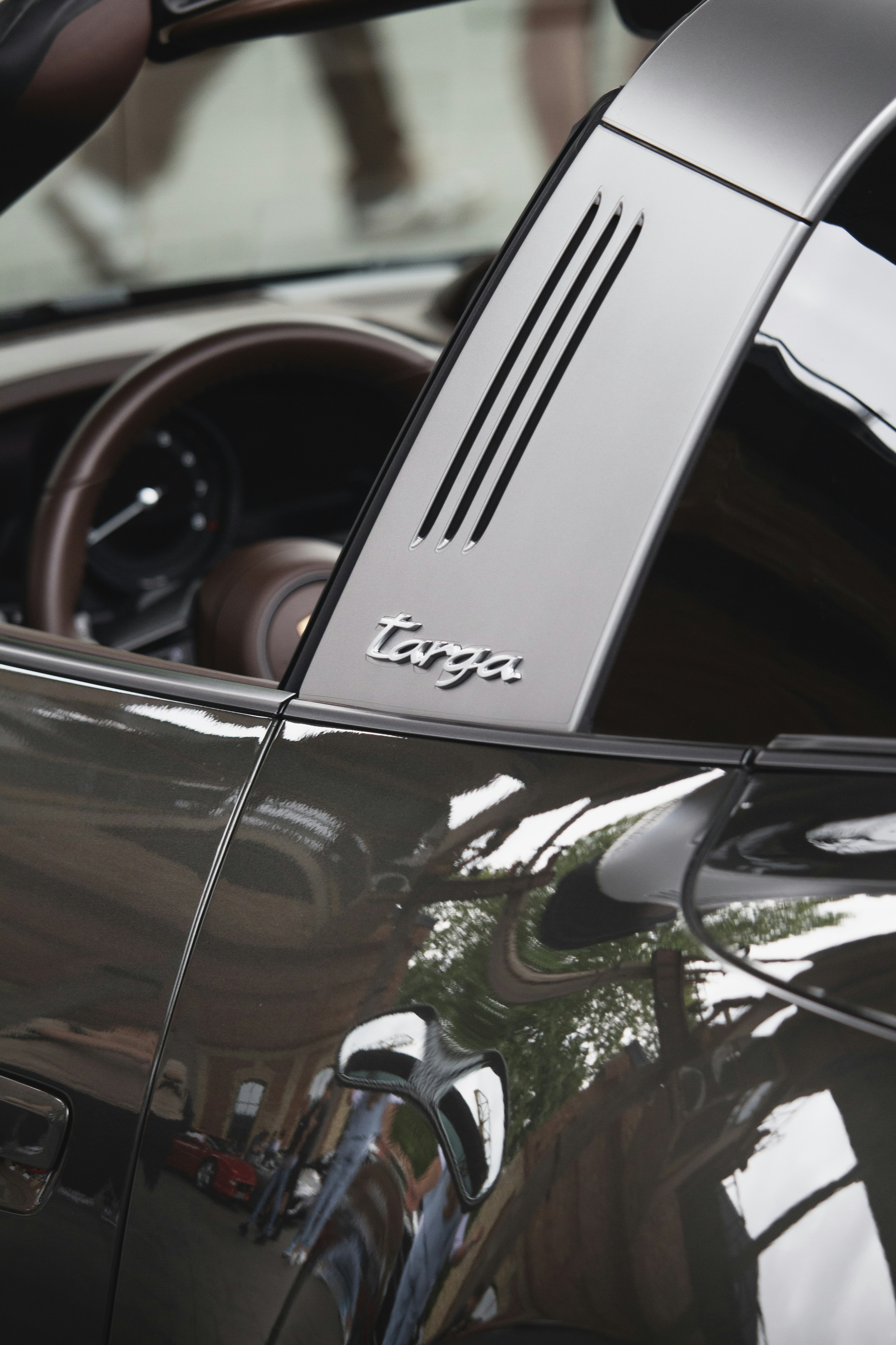 Close-up of a modern car's interior and steering wheel.