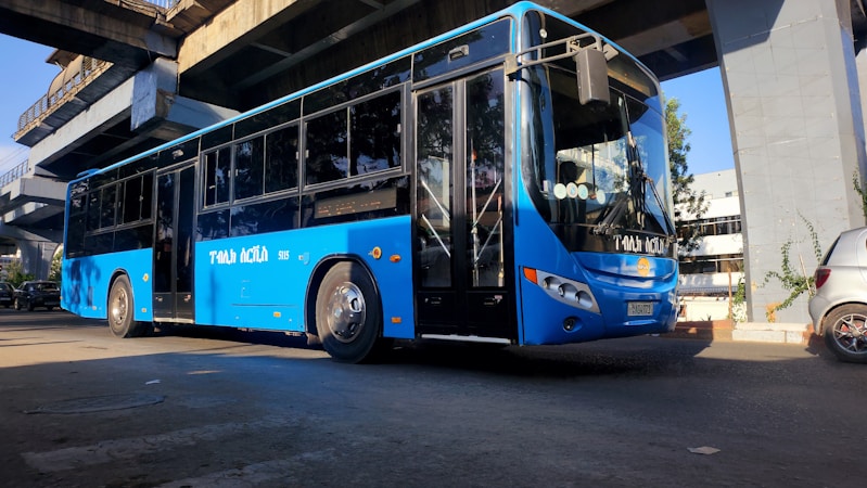 An articulated transit bus staged at a station platform, the style of high capacity vehicle used for bus rapid transit lines like the RTC RED LINE