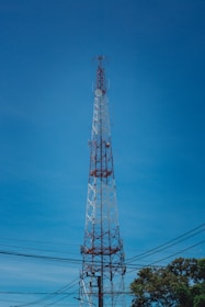 Tall communication tower against a clear blue sky