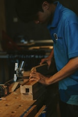 Carpenter working with wood on a workbench