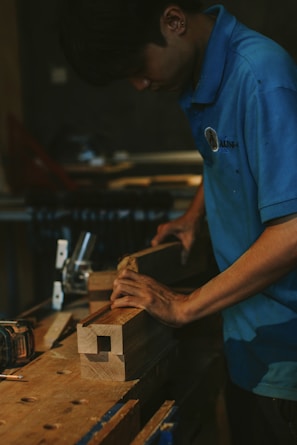 Carpenter working with wood on a workbench