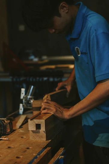 Carpenter working with wood on a workbench
