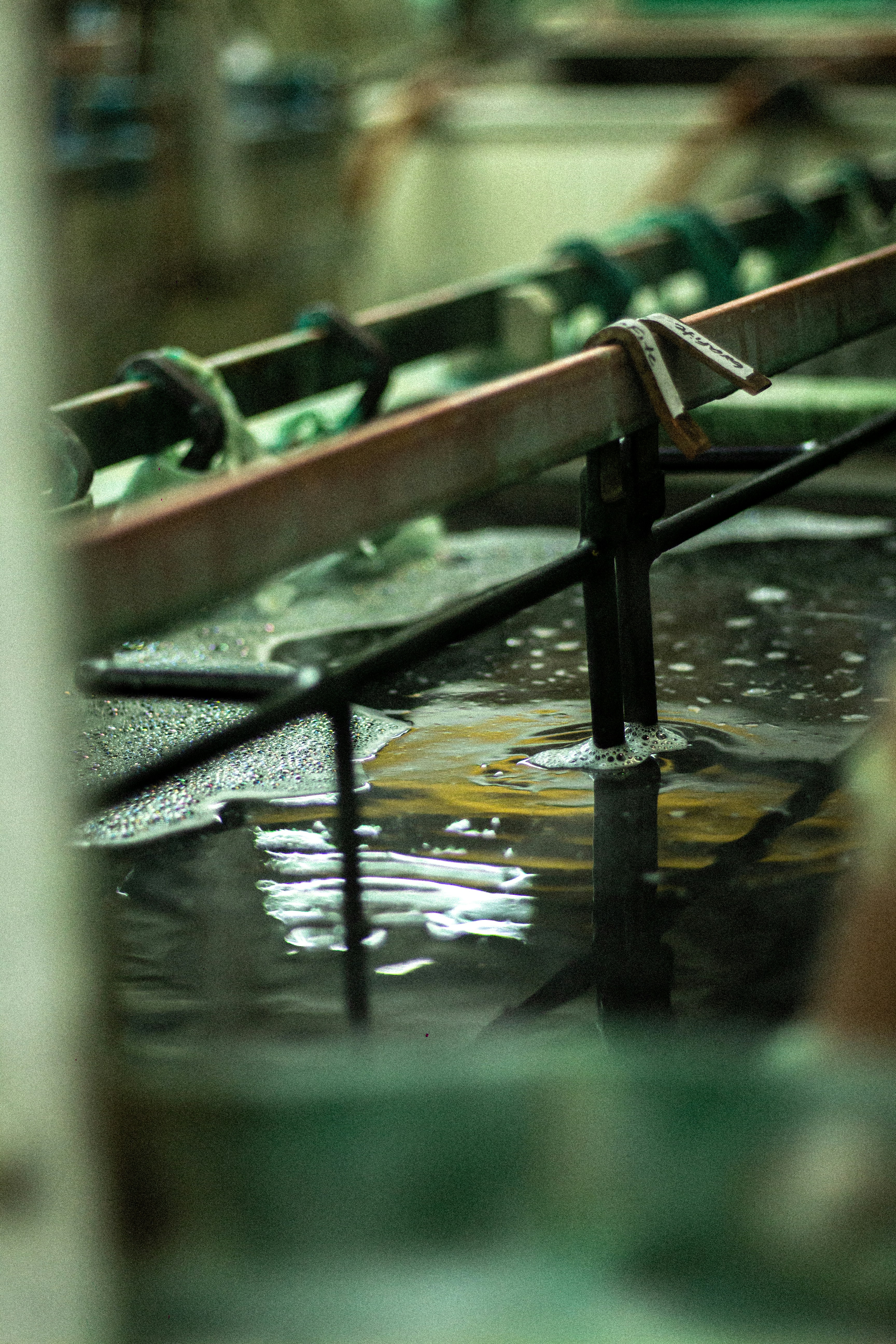 Industrial machinery over bubbling liquid