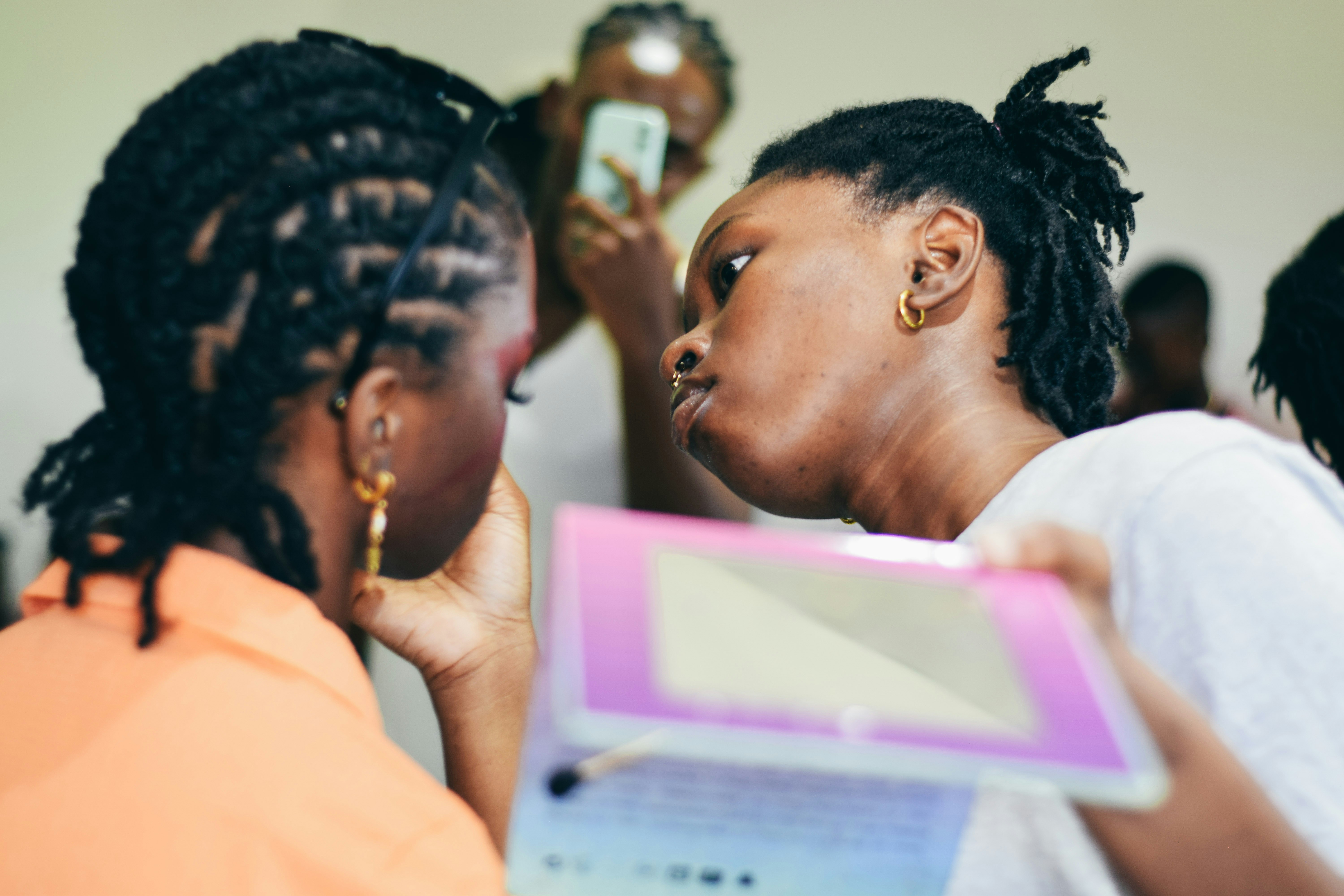 Two women looking at a tablet computer.