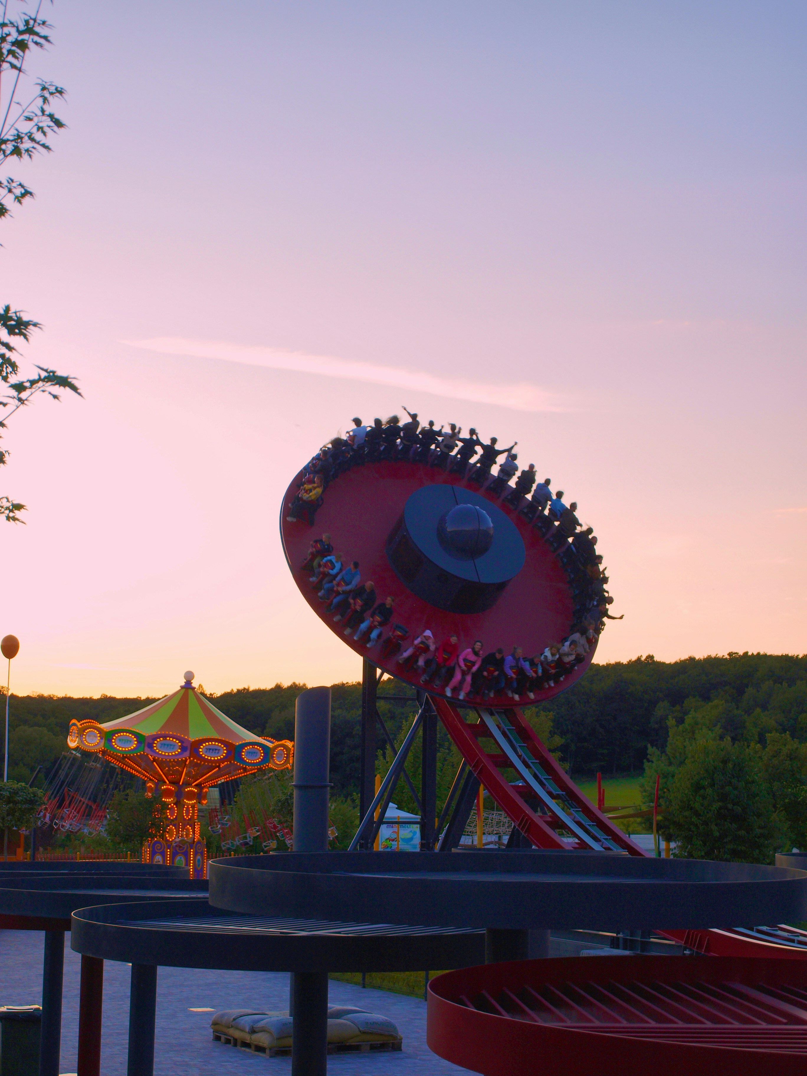 Amusement park rides with a carousel at sunset. photo – Free Image on ...