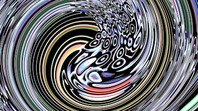 Abstract swirling pattern with concentric circles and colorful highlights