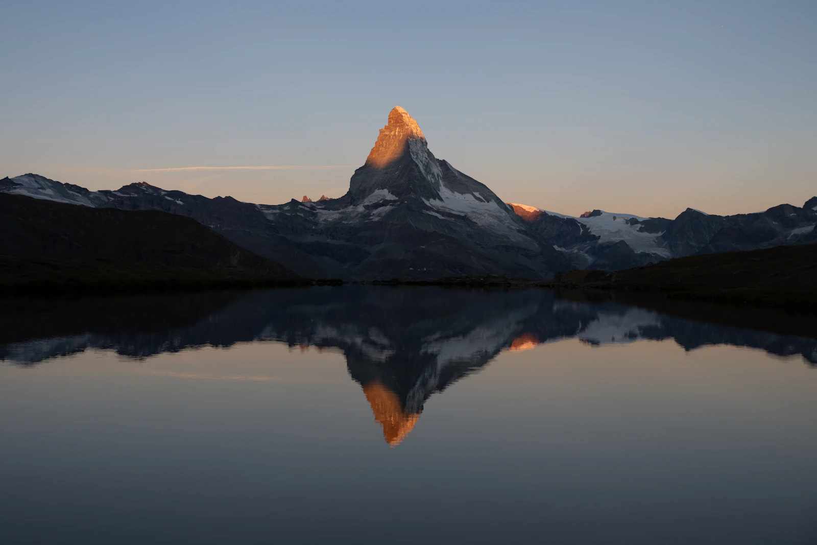 Sunrise breaking over mountain peaks