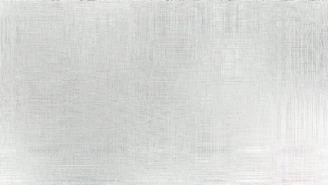 A brushed metal surface with subtle texture.