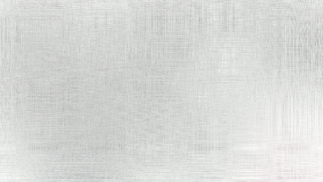 A brushed metal surface with subtle texture.