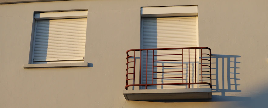 Building exterior with a window and balcony