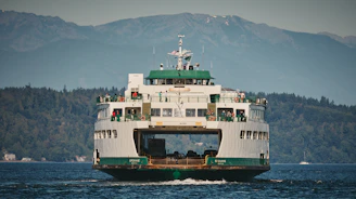 A large ferry boat travels across the water.