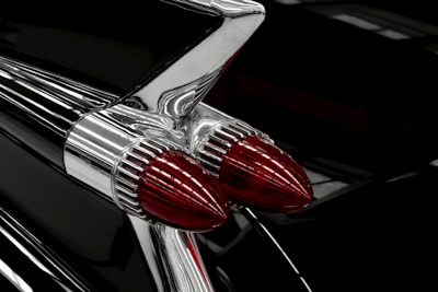 Close-up of classic car tail lights and chrome detailing