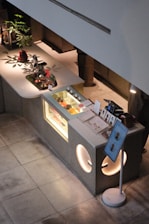 Modern dessert counter with display case and seating area.
