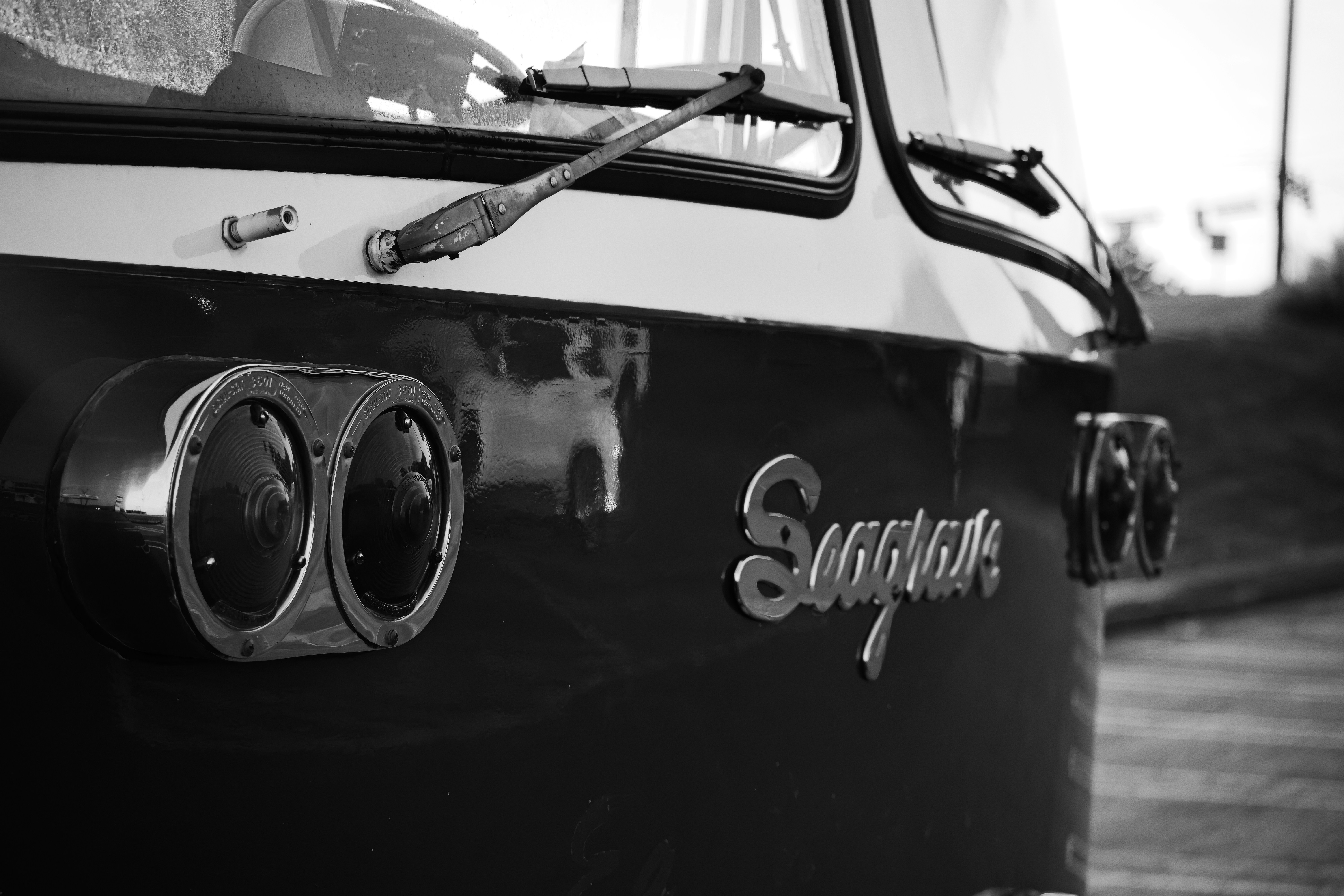 Close-up of vintage bus front with dual headlights.