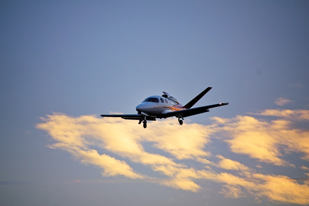 Small jet airplane flying in the sky