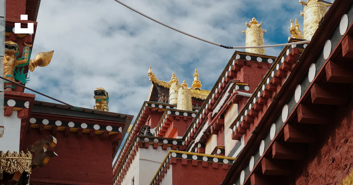 Monastery Rooftops Ornate tibetan monastery rooftops under a cloudy sky photo – Free Image ...