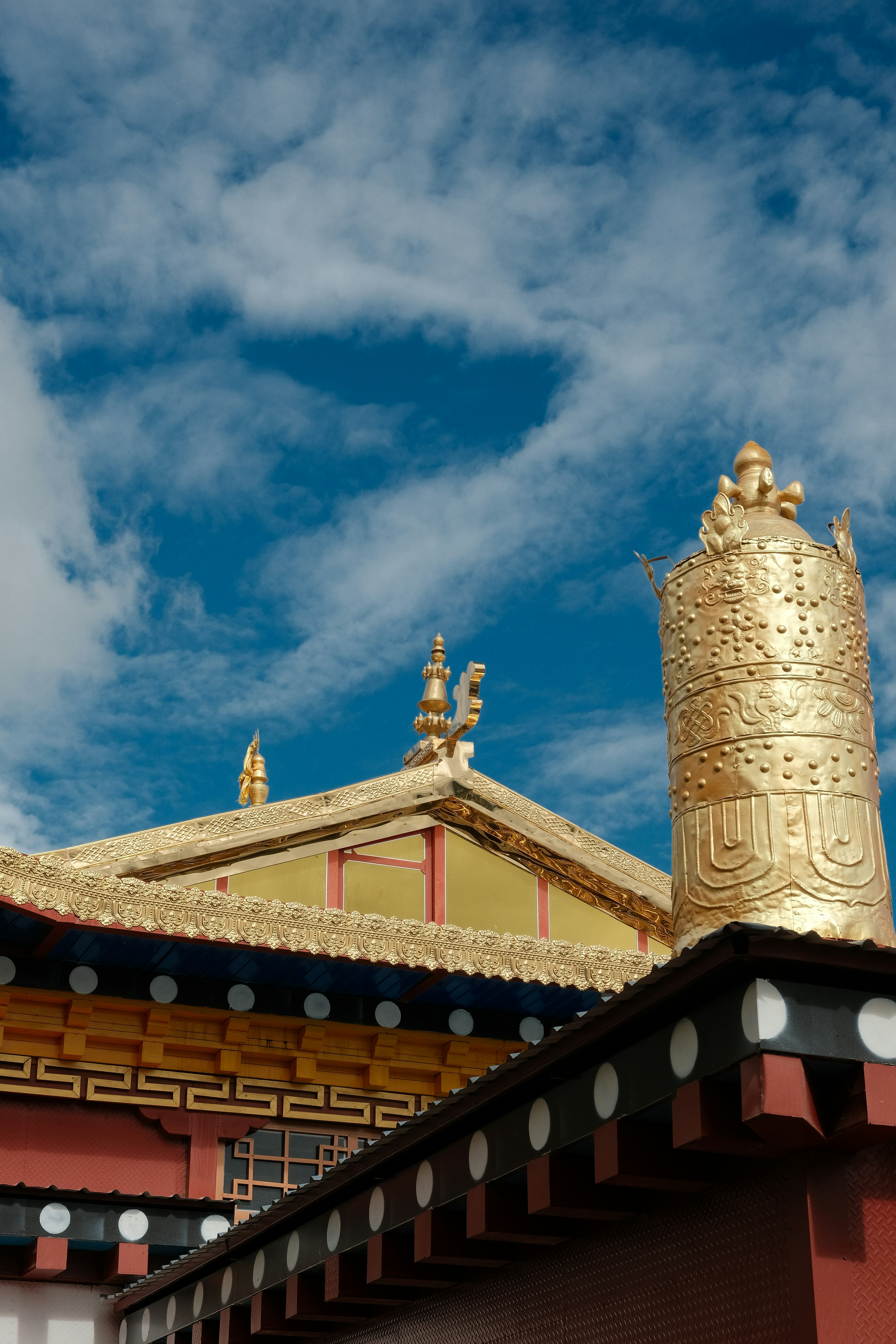 Golden temple roof against a blue sky