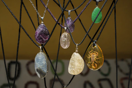 Assortment of polished stone and amber pendants