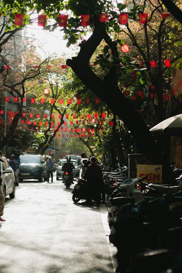 Street scene with red lanterns and trees