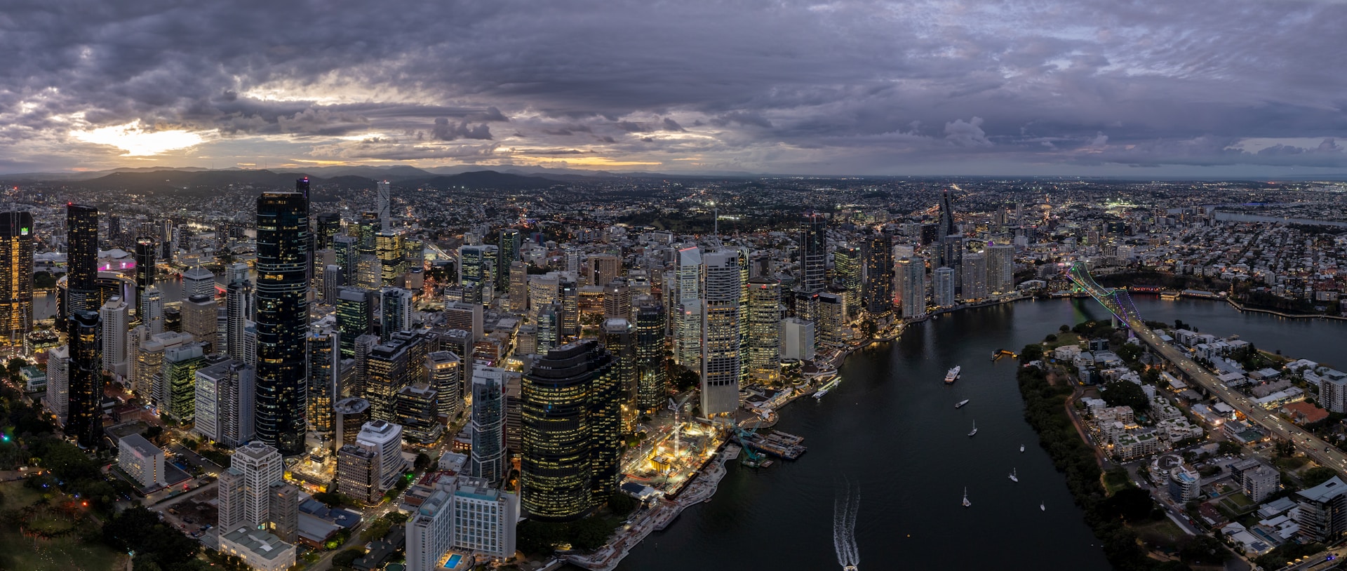 Panoramic view of a city skyline at dusk