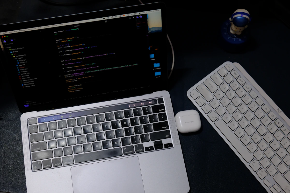 Performance laptop running development software on a dark desk