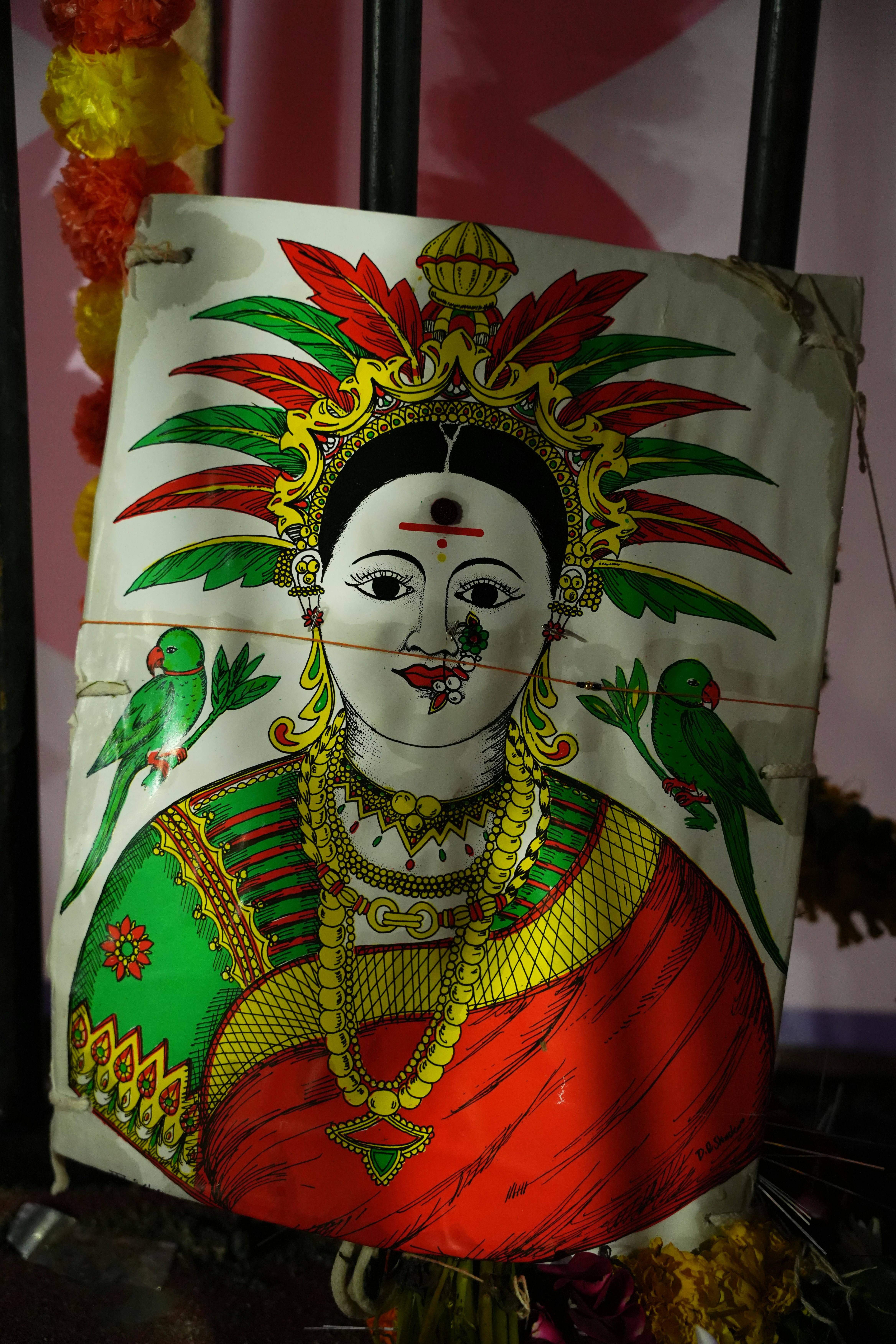 Colorful painting of a woman with parrots