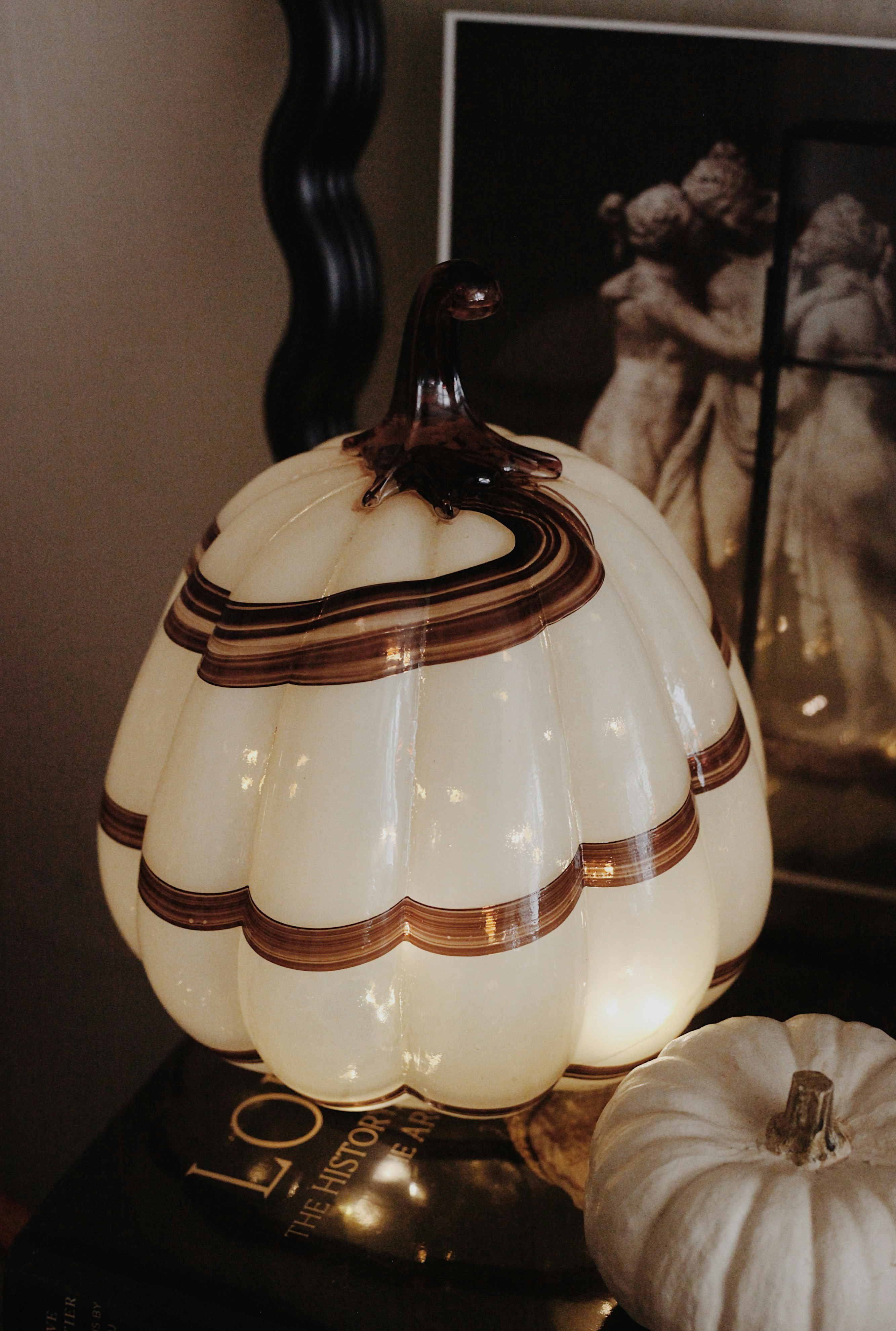 Cream colored glass pumpkin with brown swirls