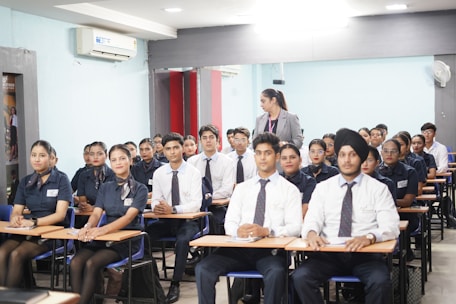 Students attending a lecture in a classroom.