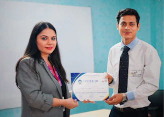 Woman presents certificate to man in office