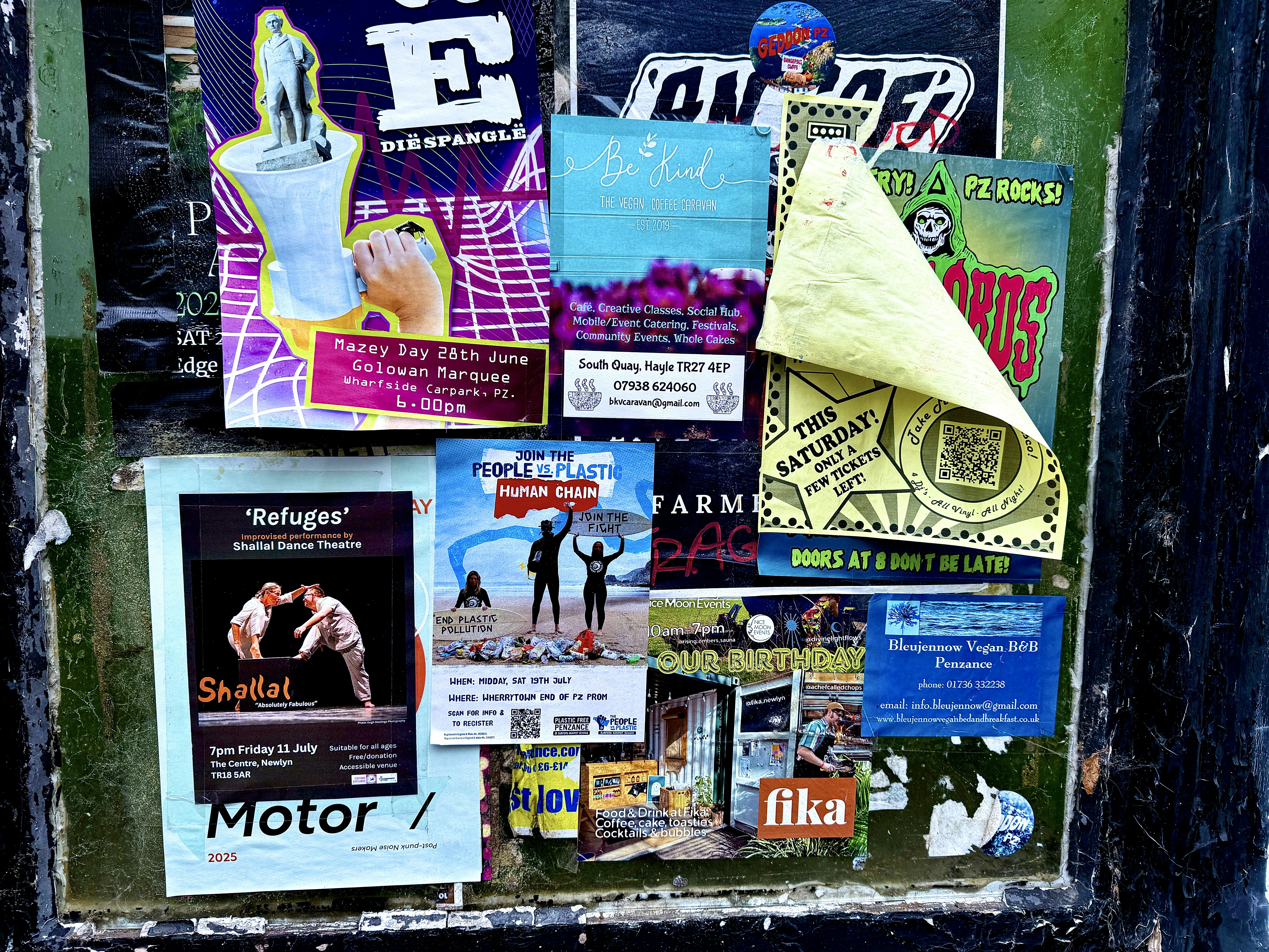 a variety of event flyers posted on a wall