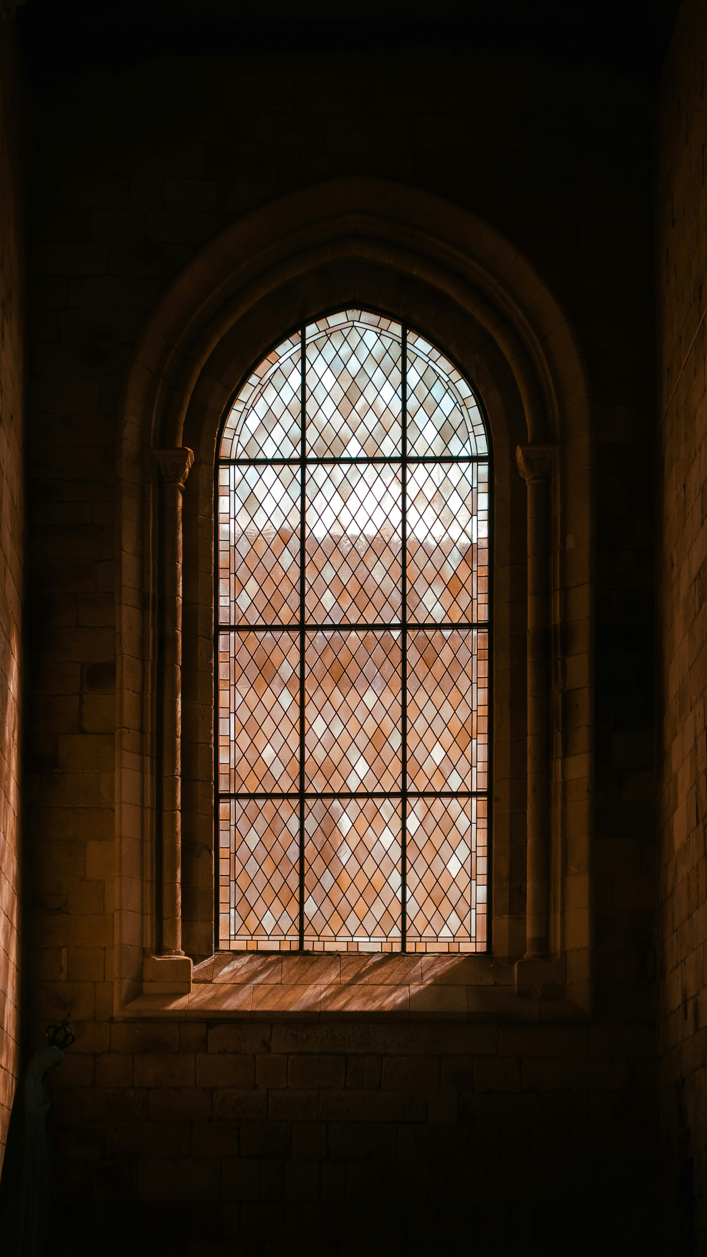 Gothic window with diamond-shaped glass panes
