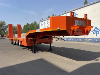 Orange heavy-duty trailer with multiple axles