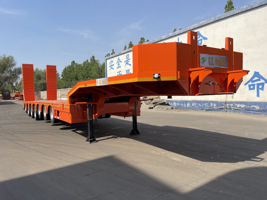 Orange heavy-duty trailer with multiple axles
