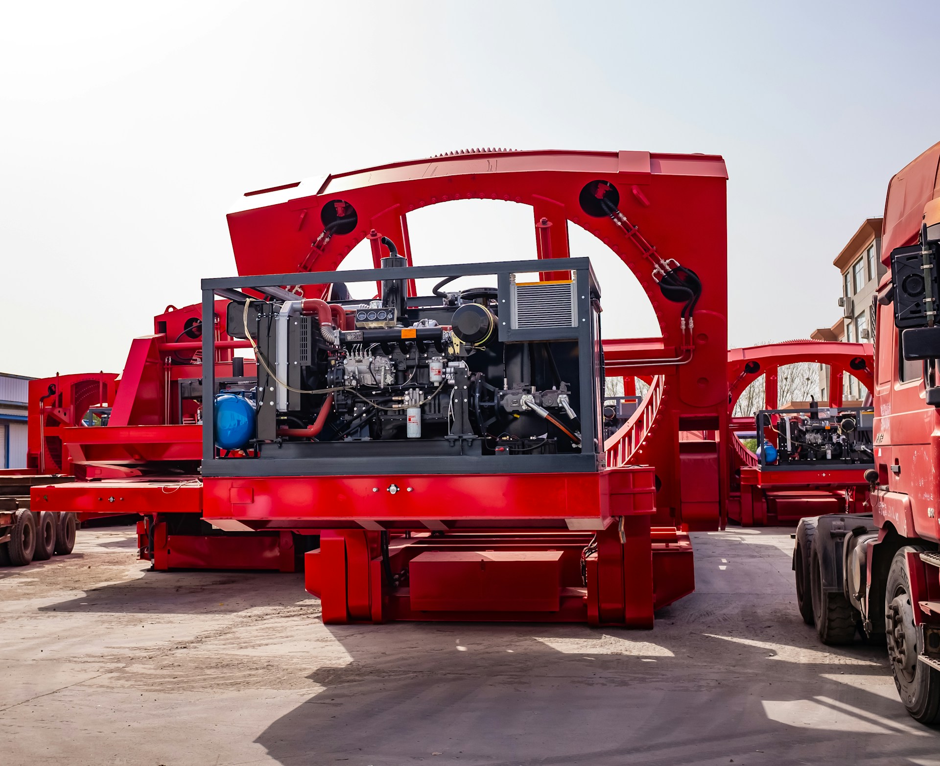Large red industrial machinery with engine components.