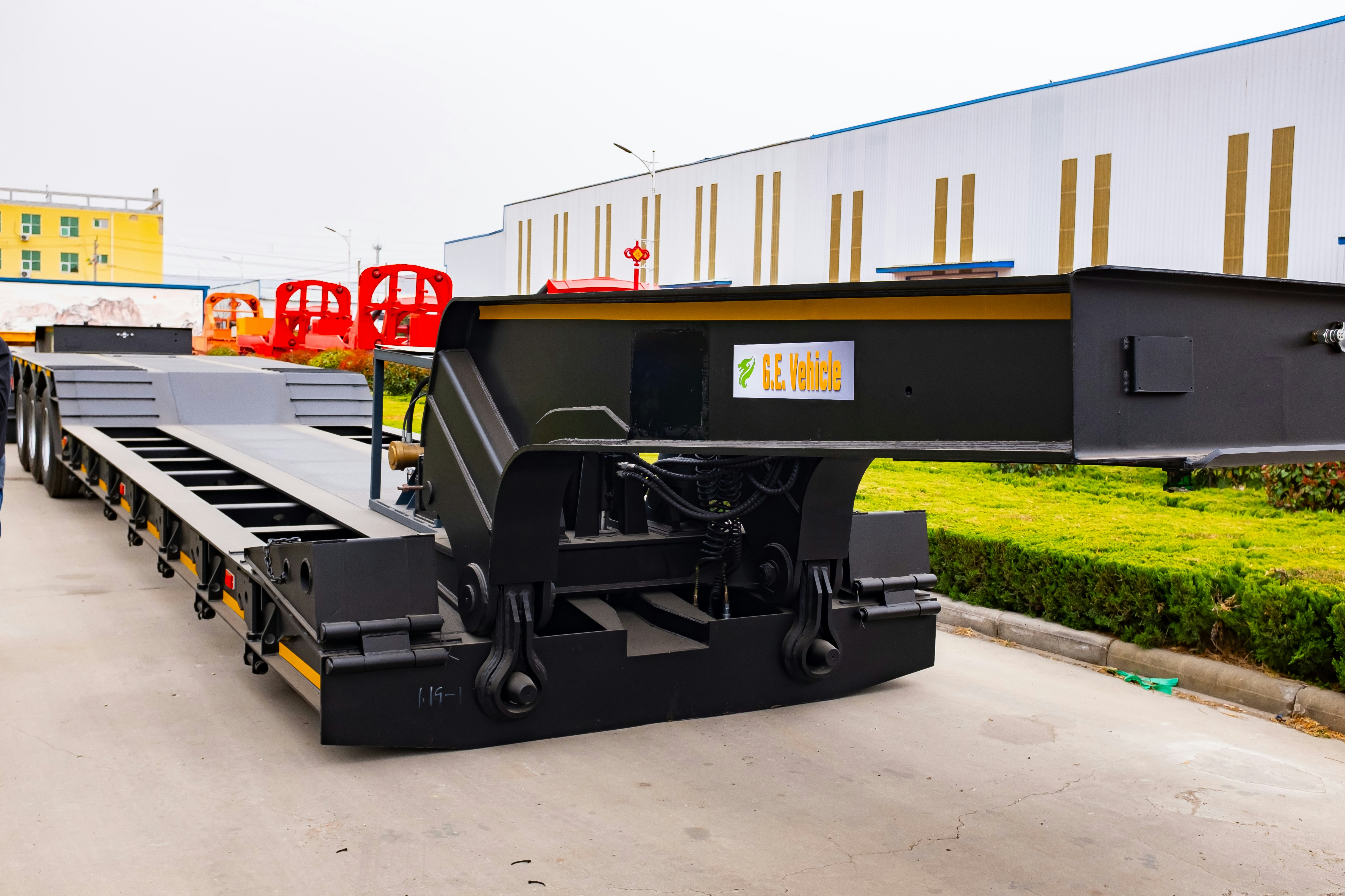 A black heavy-duty trailer parked outdoors