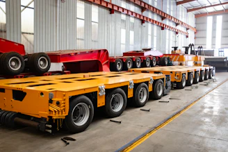 Heavy-duty modular trailers with many wheels lined up.